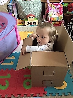 Marian's grand daughter playing in a box
